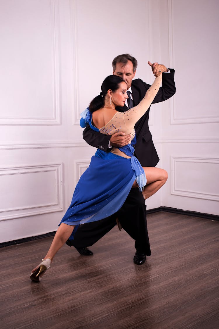 Graceful Couple Dancing In Dance Studio