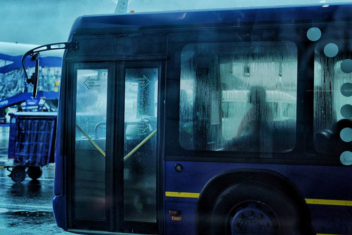 Bus waiting outside an airport terminal