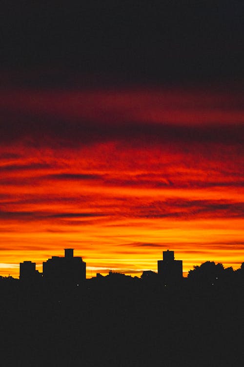 Bright colorful sunset sky over city