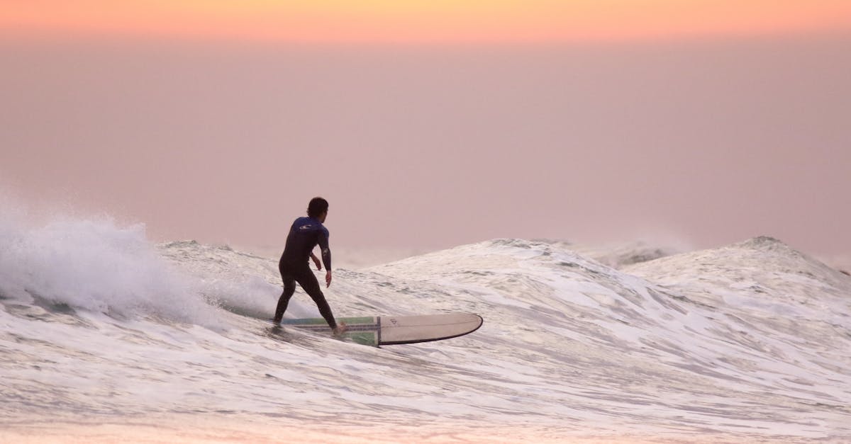 Man Doing Surfing at Golden Hour