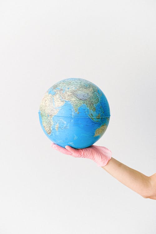 A Person Holding a Globe