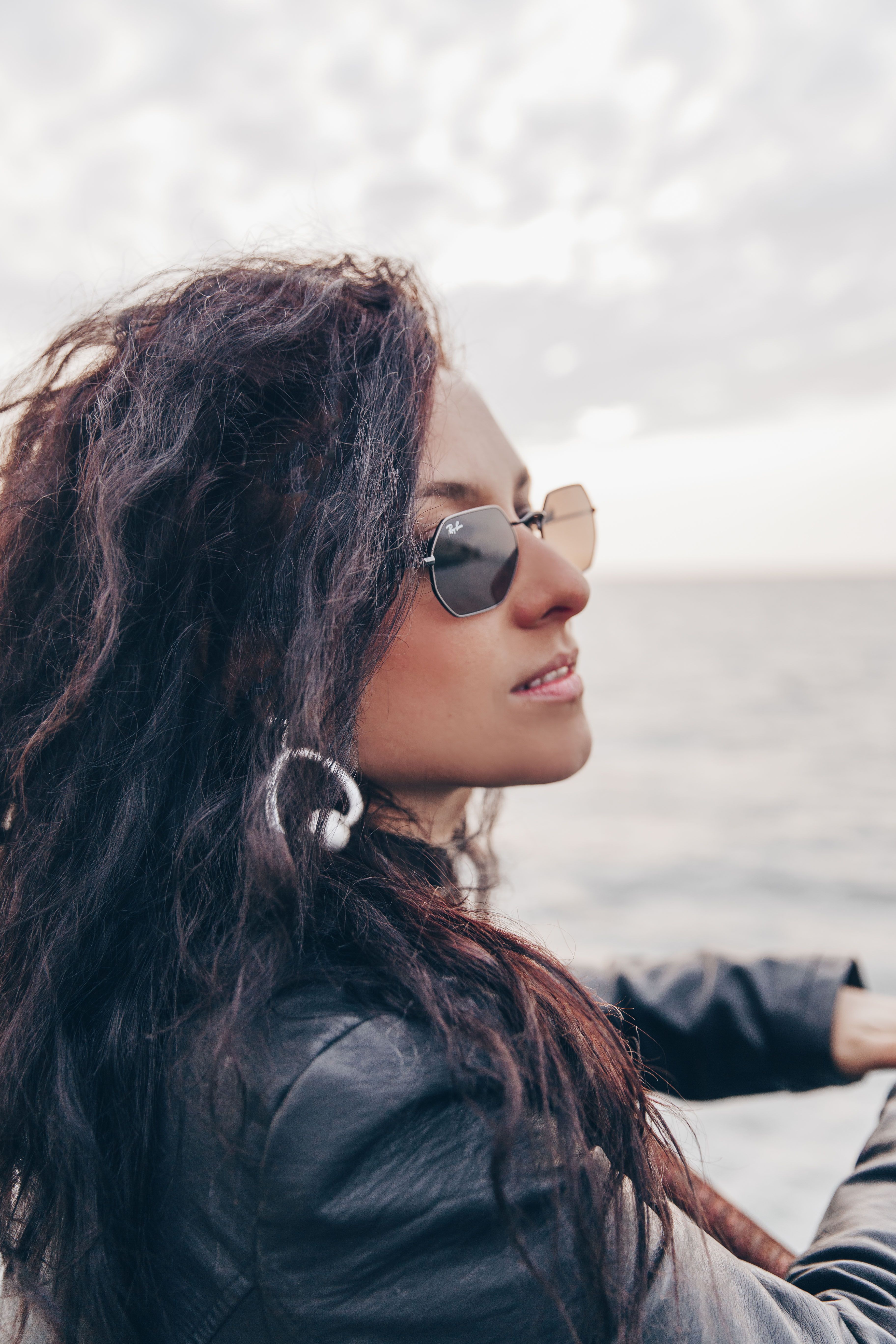 A Woman in Black Sunglasses and Black Jacket · Free Stock Photo