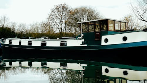 Blue and White Boat on the River