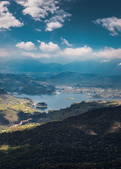 Aerial View of Mountains Under the Blue Sky