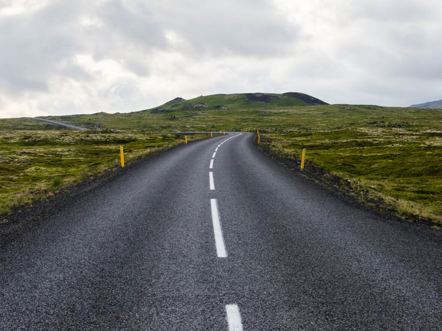 Gray Concrete Road Towards Green Mountain