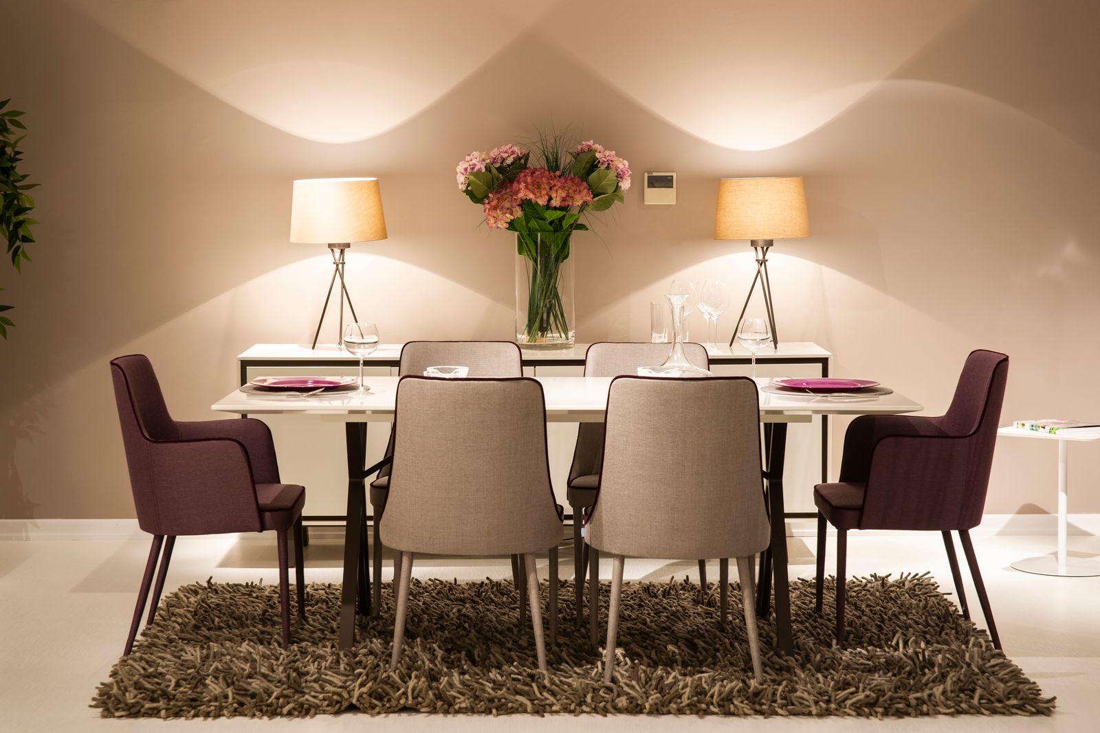 modern dining room with decorative lighting over the table