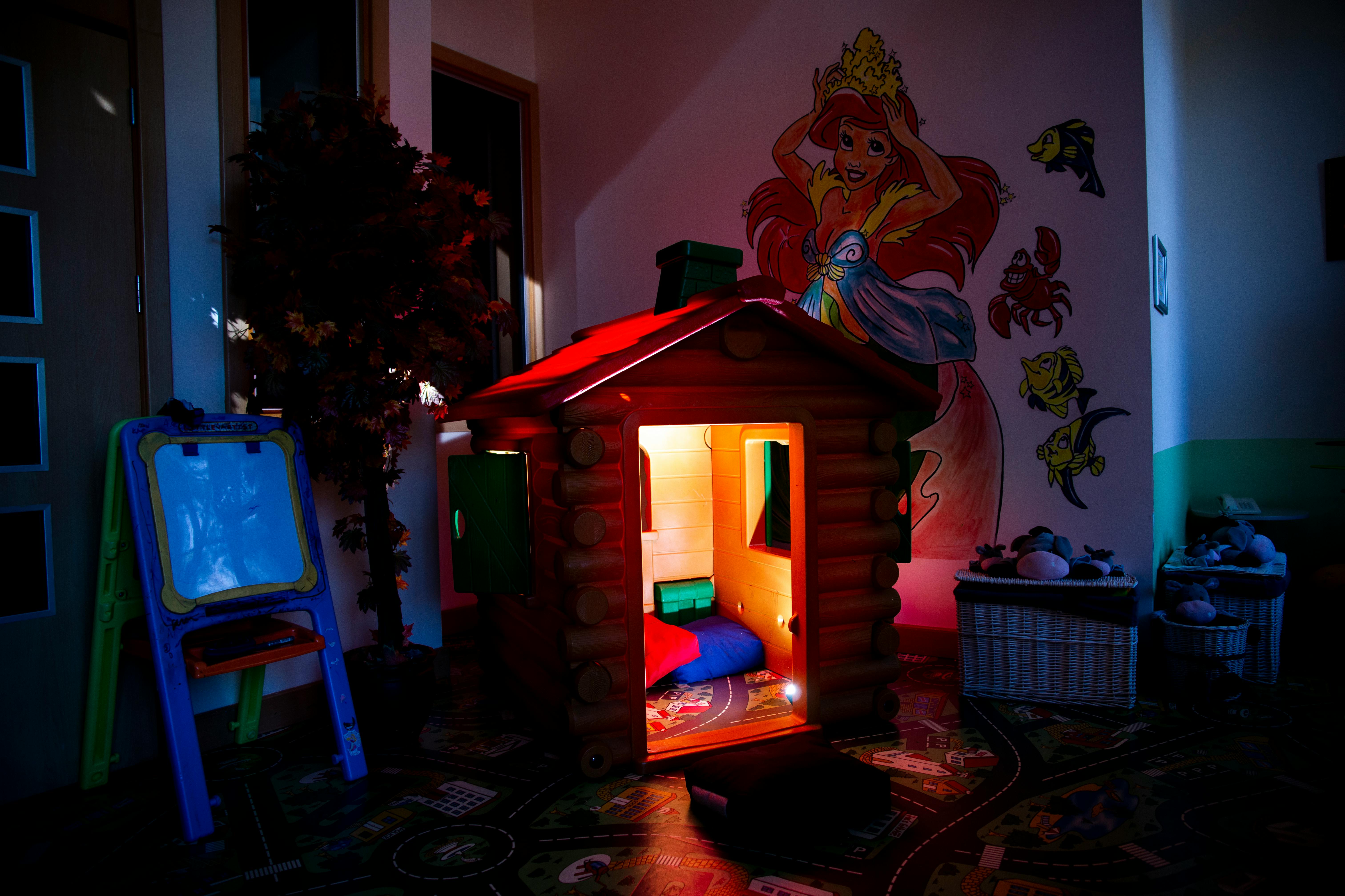 an illuminated toy house