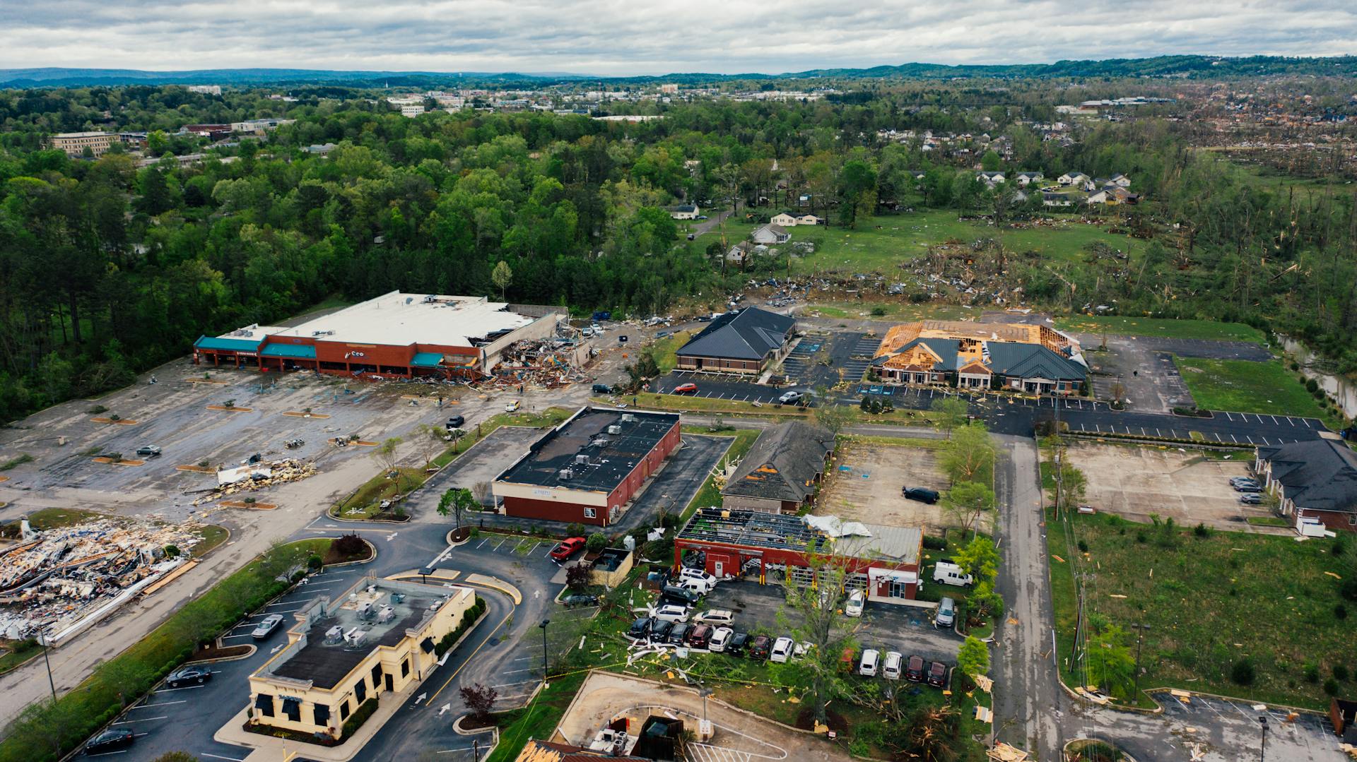 Aerial view showcasing tornado aftermath in Chattanooga, highlighting extensive building damage.