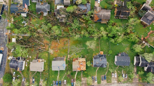 Small settlement cottages with destroyed roofs after hurricane