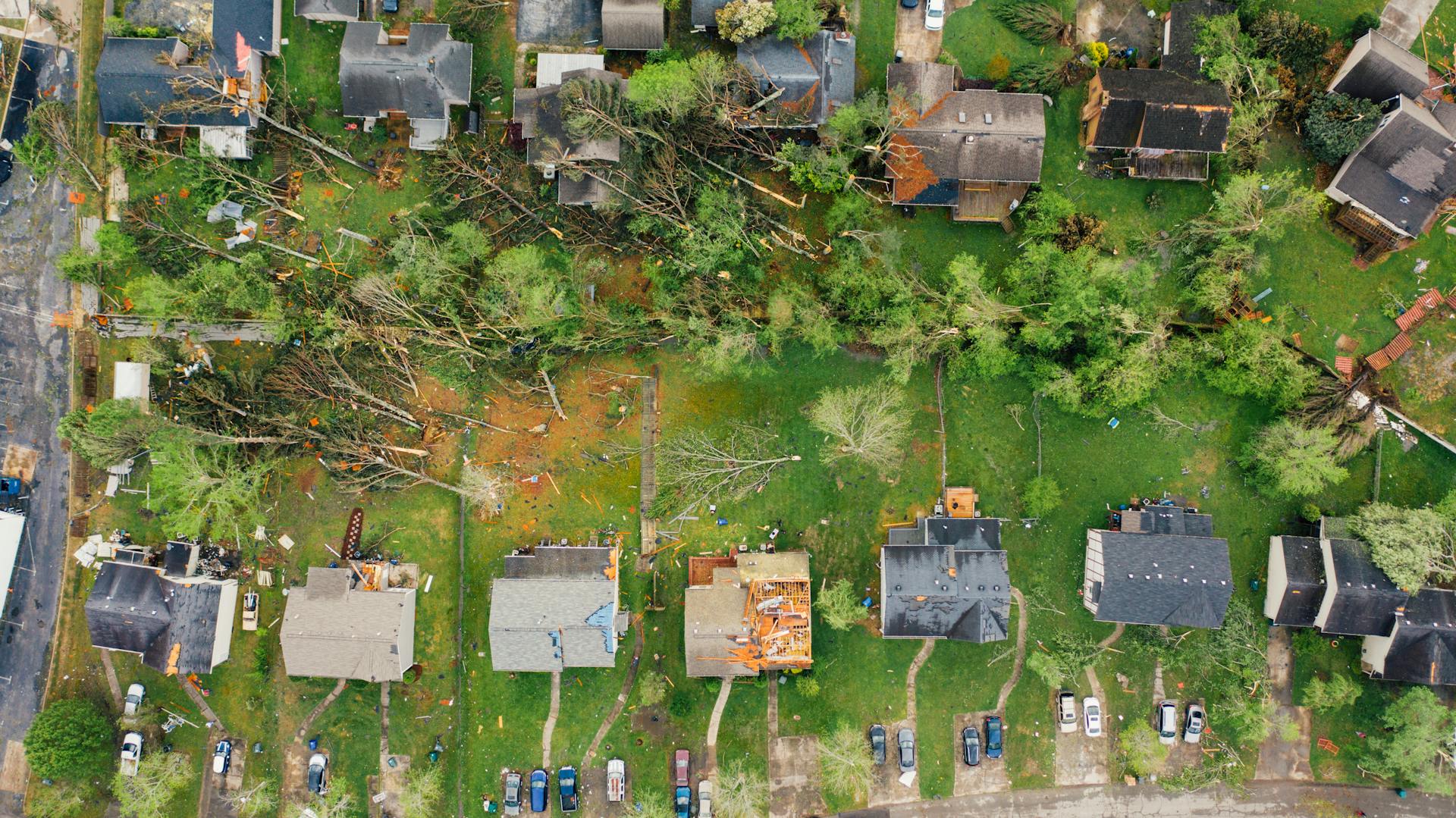 Dramatic aerial shot of tornado aftermath in Chattanooga, Tennessee neighborhood.