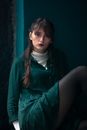 A Woman in Green Long Sleeve Dress