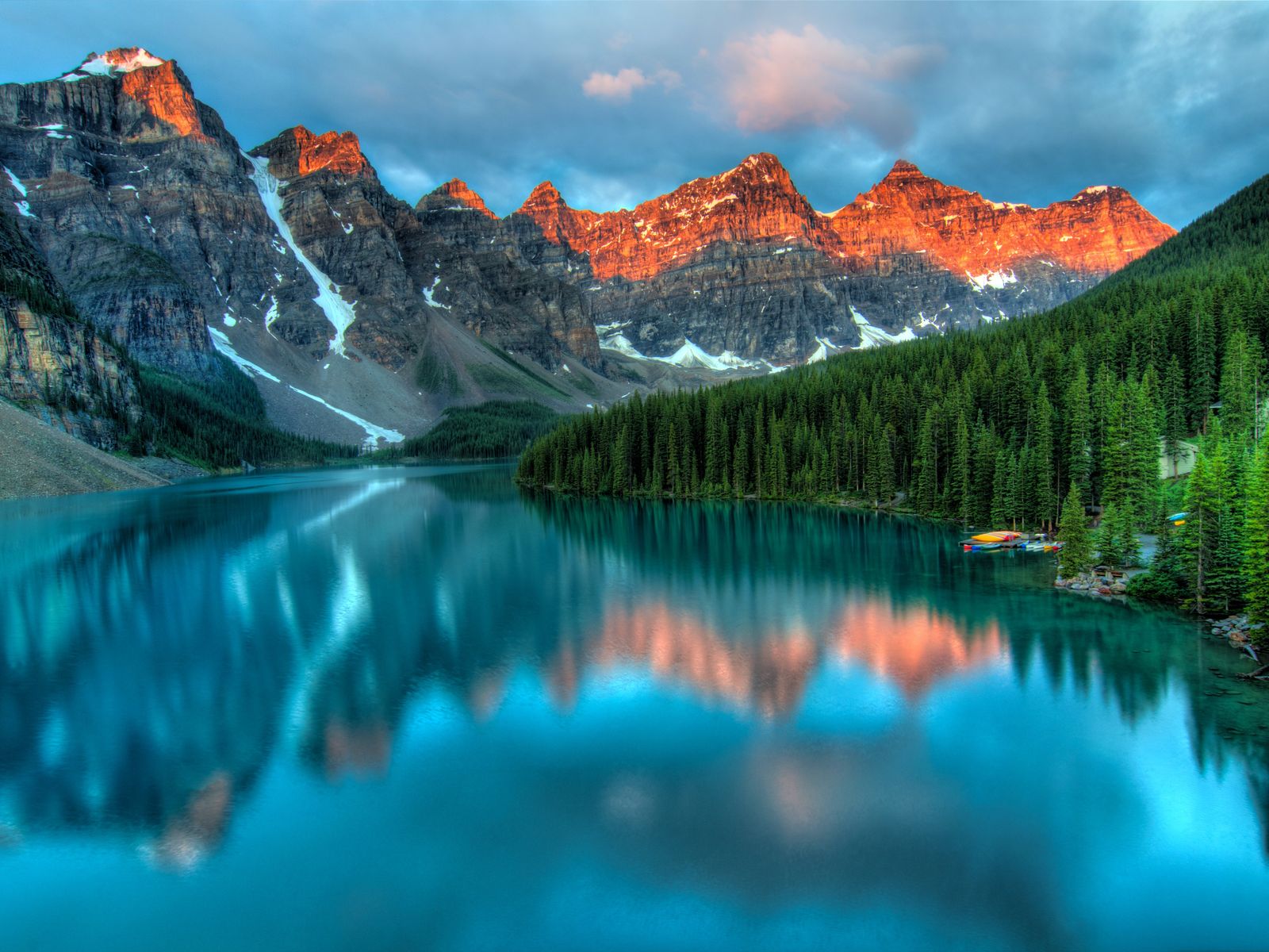 Peaceful landscape with water, trees, and mountains