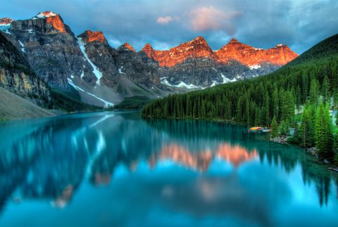 Still mountain lake reflecting the evening sky