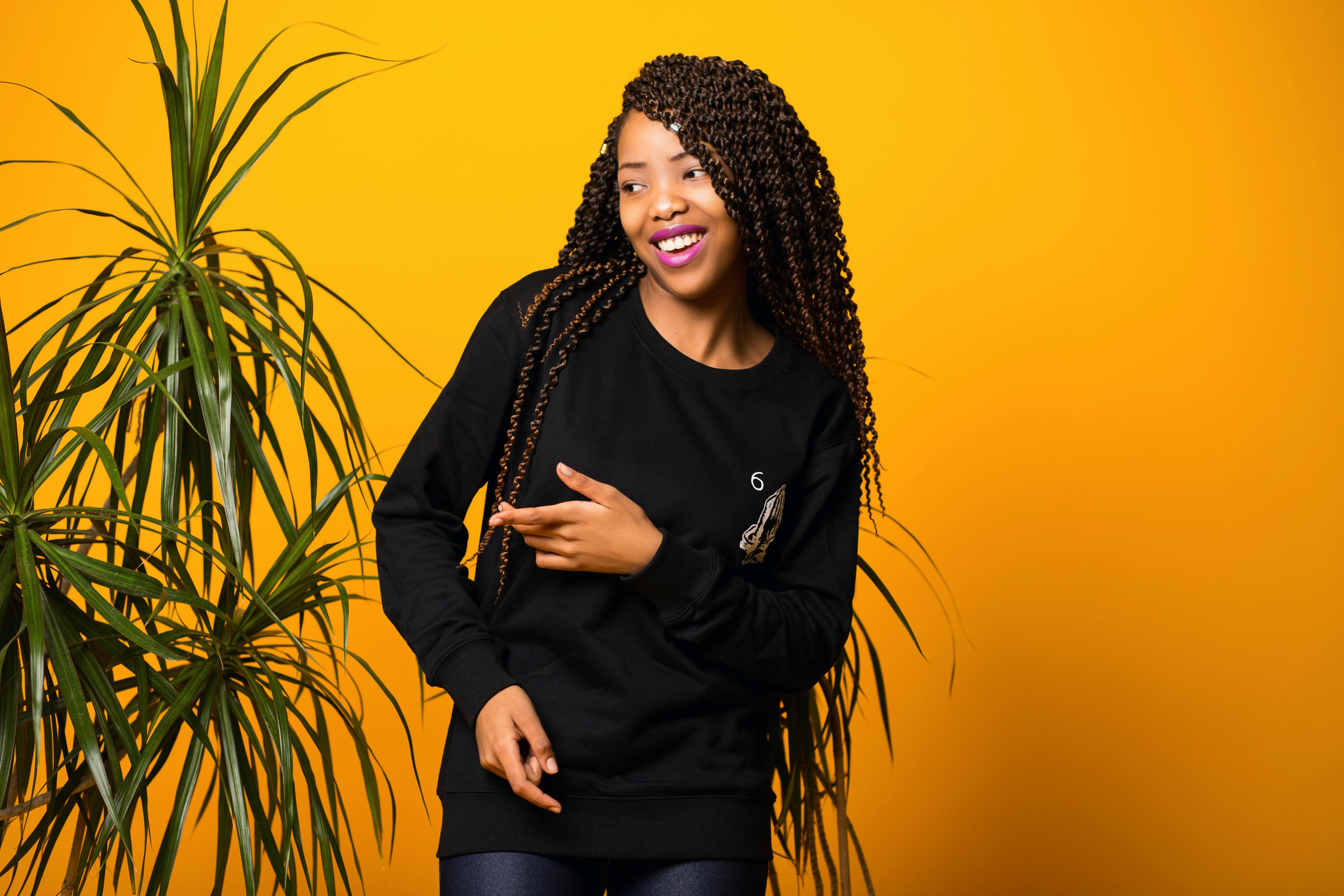 Optimistic young black female having fun in yellow studio · Free Stock ...