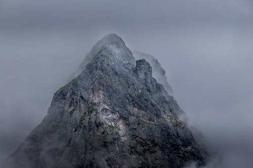 Gray Rocky Mountain Under the Cloudy Sky