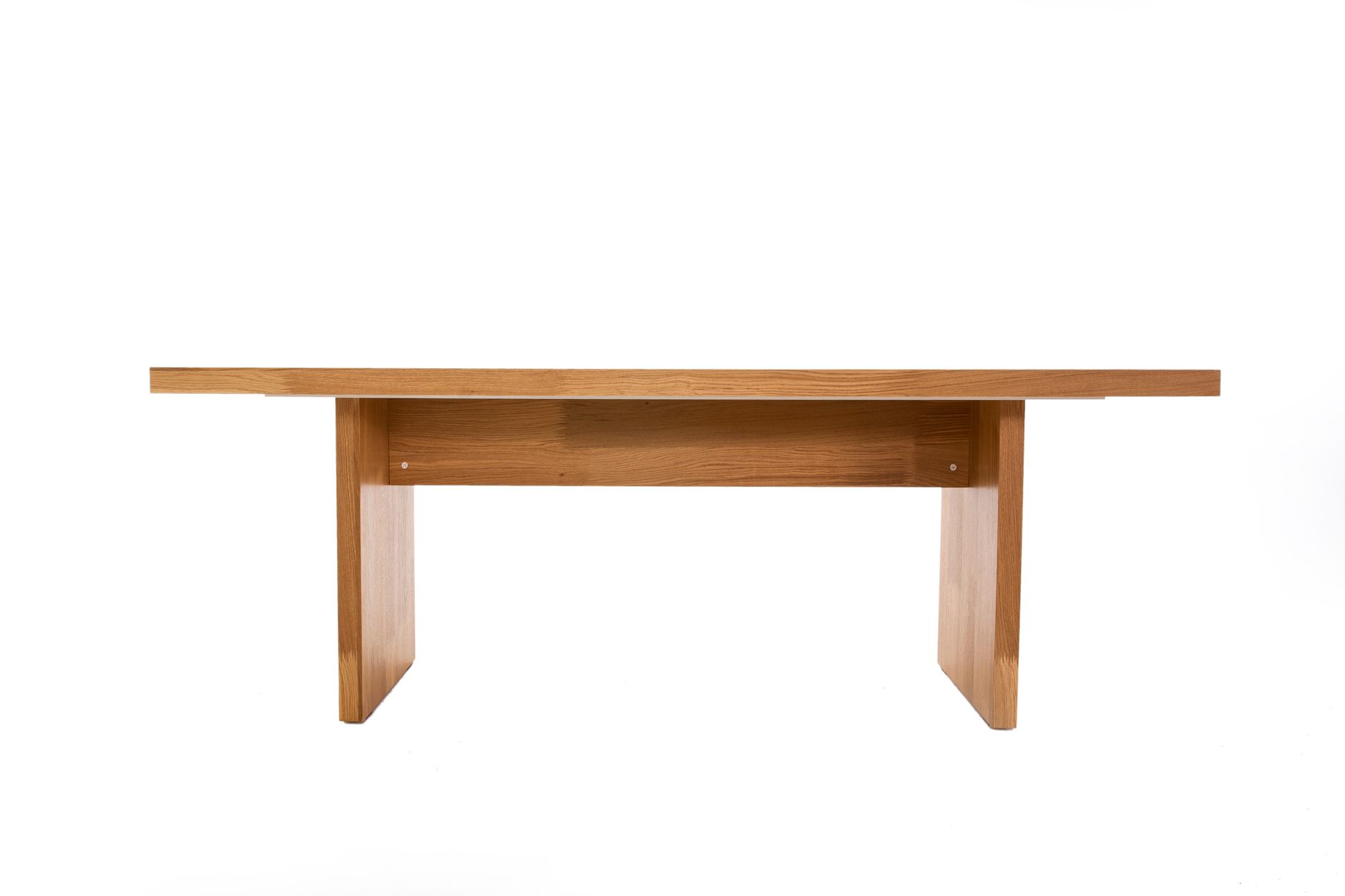 Simple wooden table with clean design against a white backdrop.