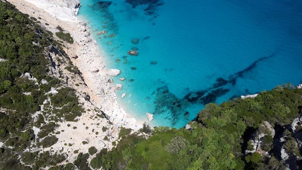 Stunning aerial shot of Cala Goloritzé, Sardinia with turquoise waters and rocky coastline. by Pixabay