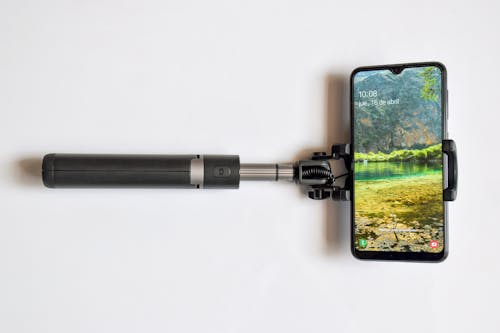 Close-Up Shot of a Smartphone on a Selfie Stick
