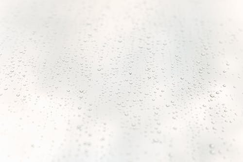 Free Glistening drops on surface of glass Stock Photo