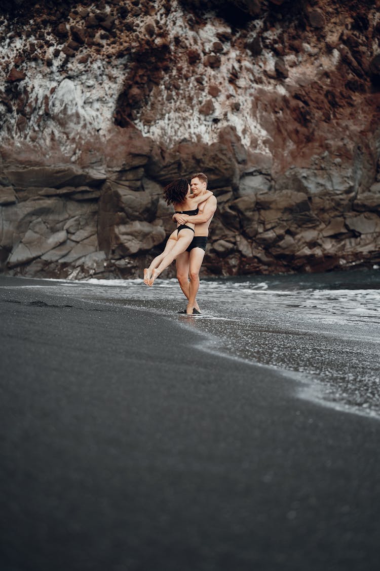 Happy Couple Hugging While Spinning Around