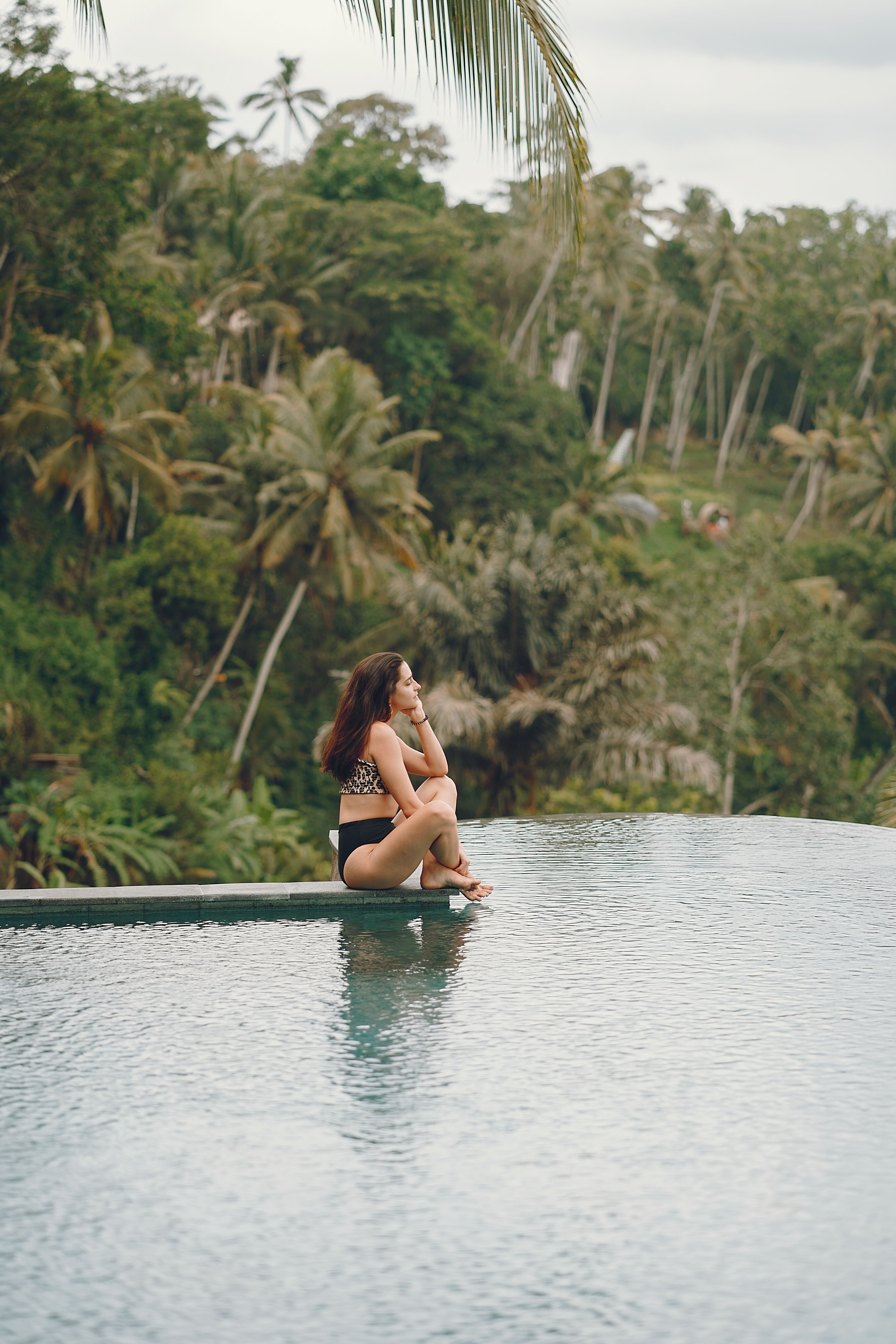 Infinity pool at an Ubud jungle resort surrounded by green rice terraces, a romantic Bali stay for couples