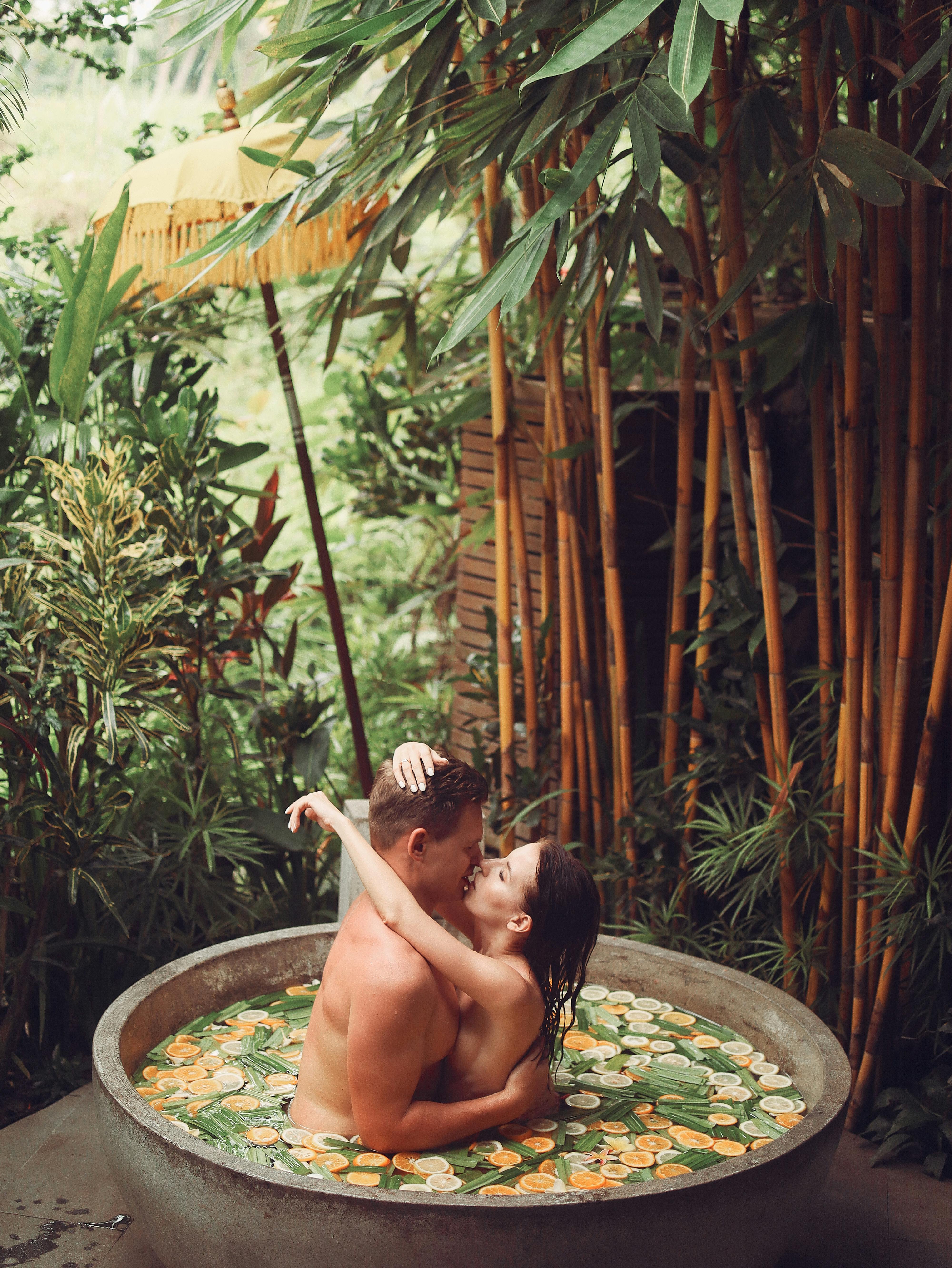 Sensual loving couple do foreplay in fruit bath · Free Stock Photo