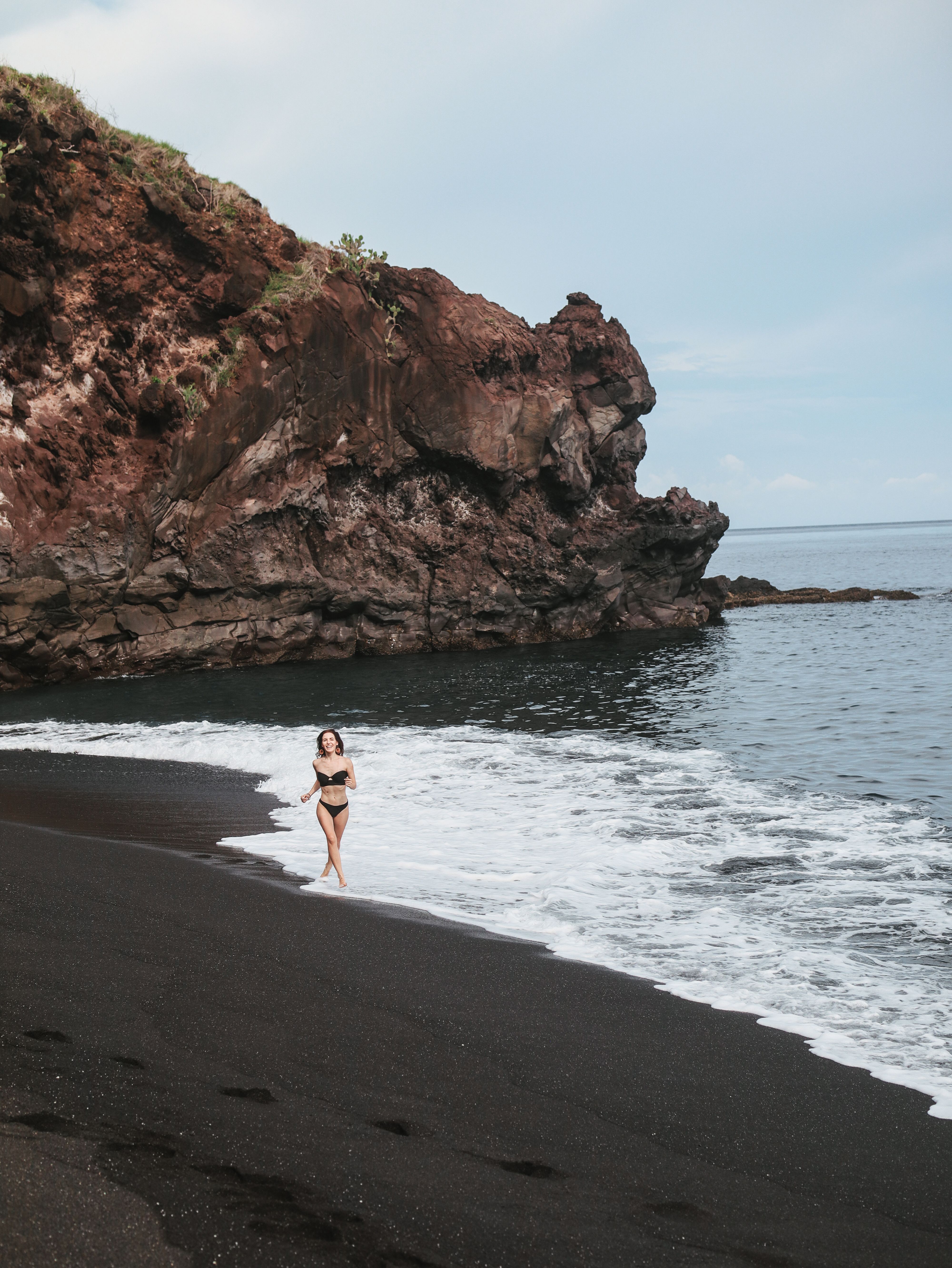 A Woman in Bikini Standing on the Beach · Free Stock Photo