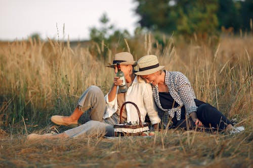 Loving female couple enjoying romantic picnic