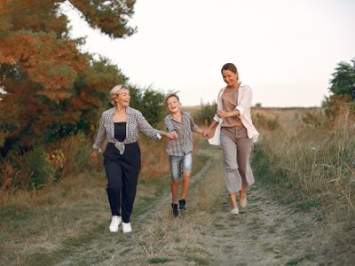 Happy multigenerational family walking together in countryside