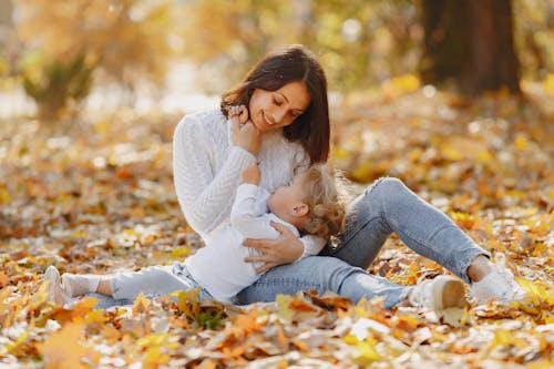 Happy mother and daughter hugging in park