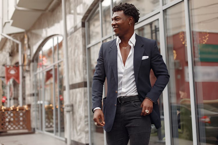 Confident Stylish Man In Elegant Suit Walking Along Street