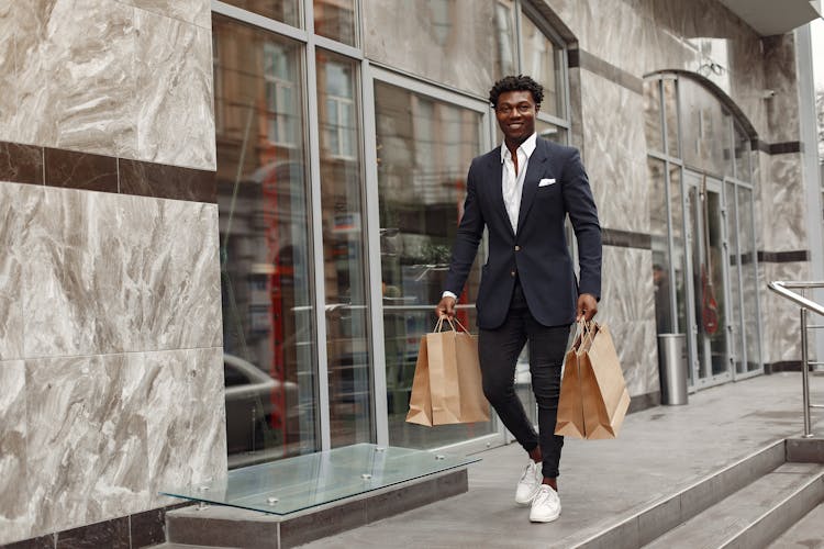 Elegant Man Walking With Shopping Bags