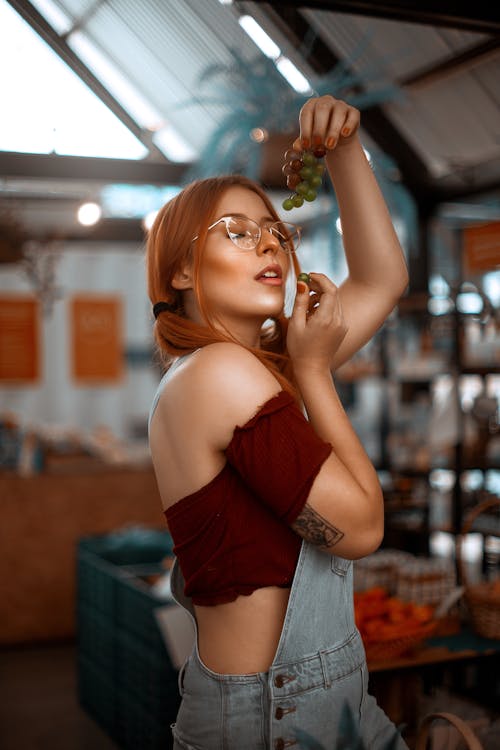 A Woman Holding Grapes 