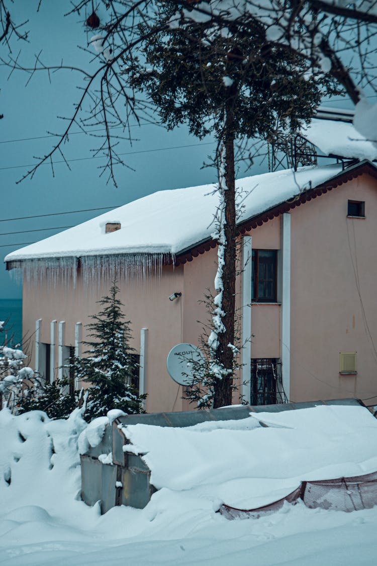 Beige House Covered With Snow