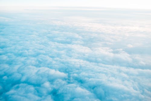 Blue endless sky covered with clouds