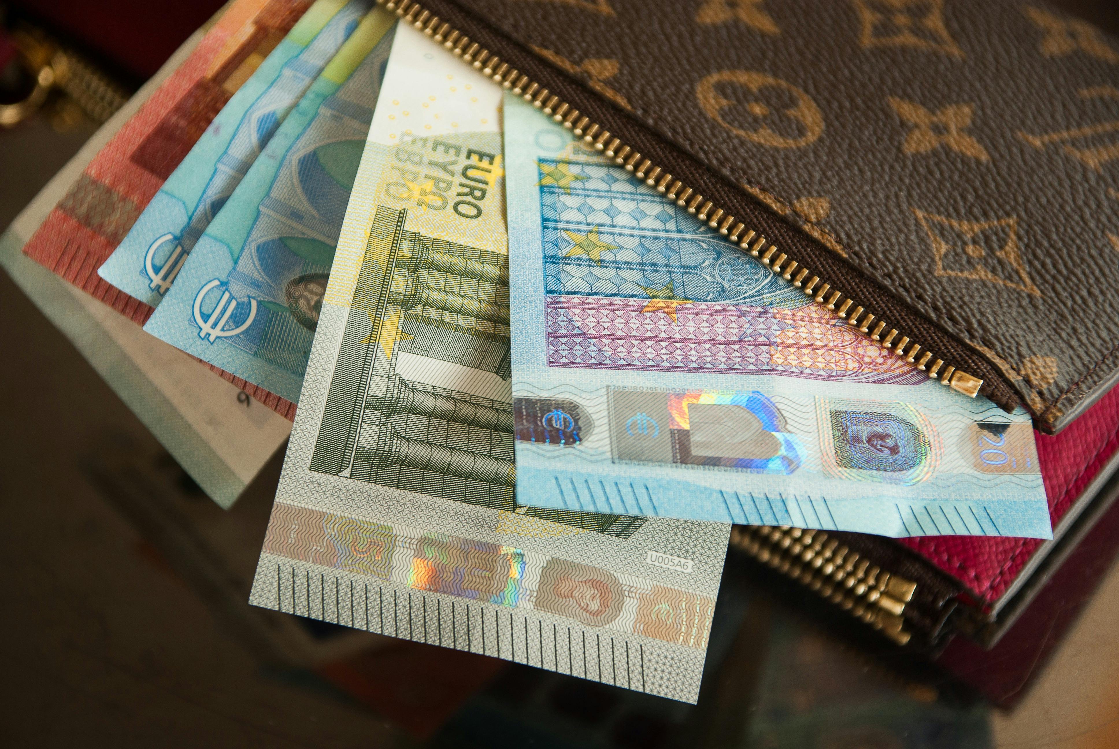 Several Euro Banknotes in Louis Vuitton Wallet · Free Stock Photo