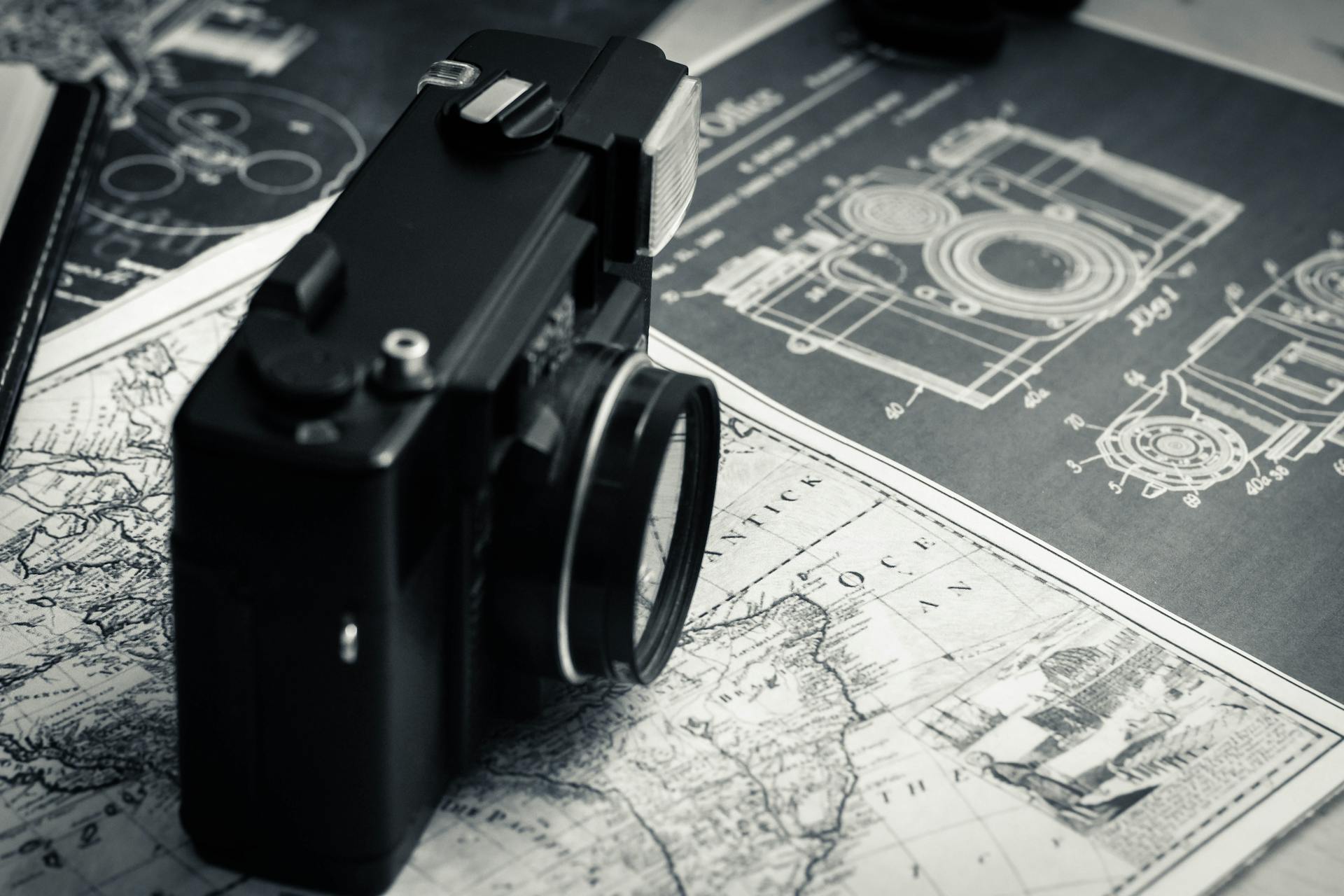 Vintage photo camera on old map