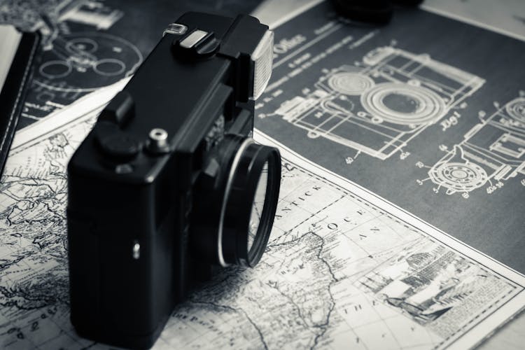 Vintage Photo Camera On Old Map