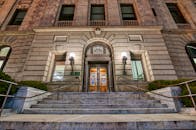 Entrance of classic aged palace with lamps