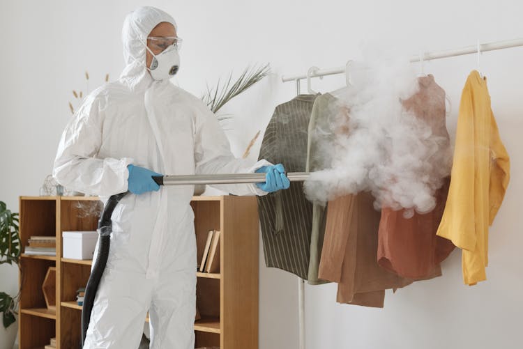 A Woman Disinfecting Clothes