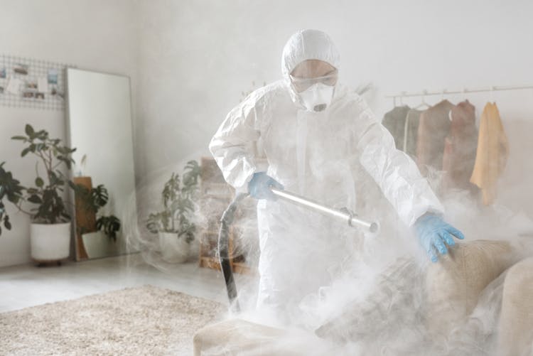 A Woman Disinfecting Pillows