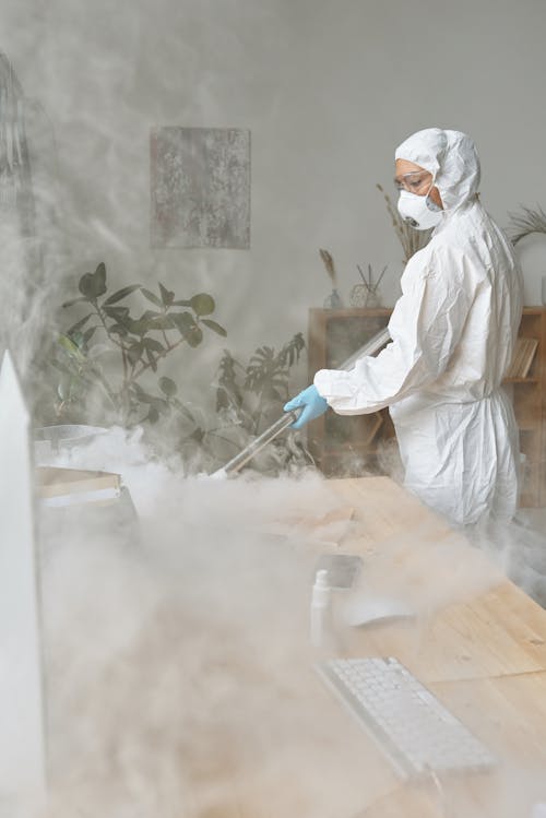 A Woman Fumigating a Table