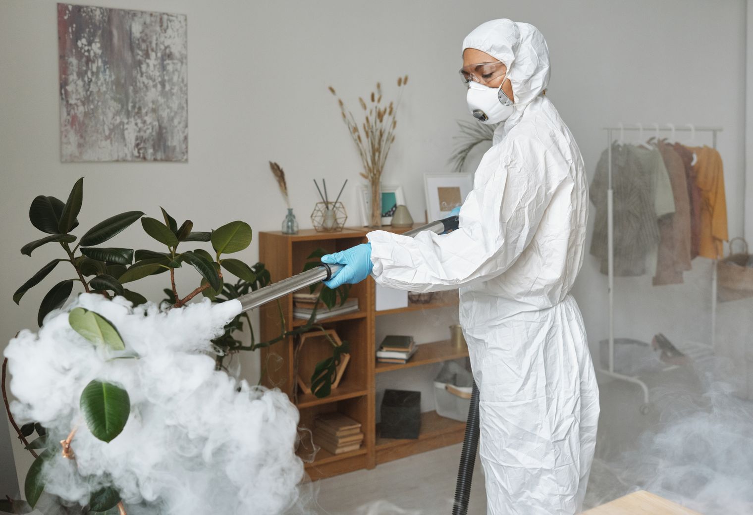 Kitchen Spraying in Thames View — a decorator at work mid-project