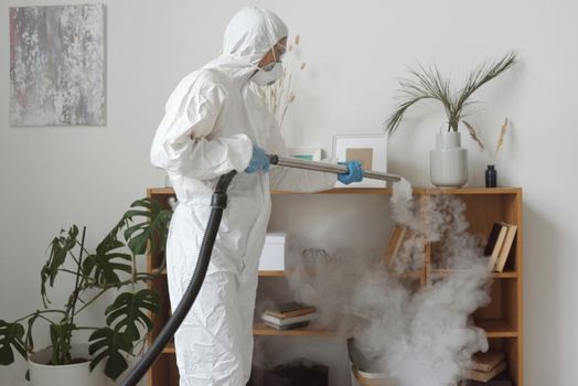 A Woman Fumigating a Wooden Shelf