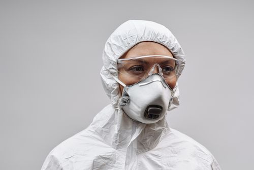 Free Healthcare professional wearing full PPE, including mask and goggles, for virus protection. Stock Photo