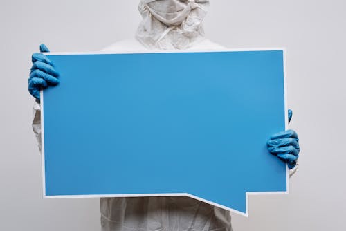 Free Person Holding a Blank Blue and White Signage Stock Photo
