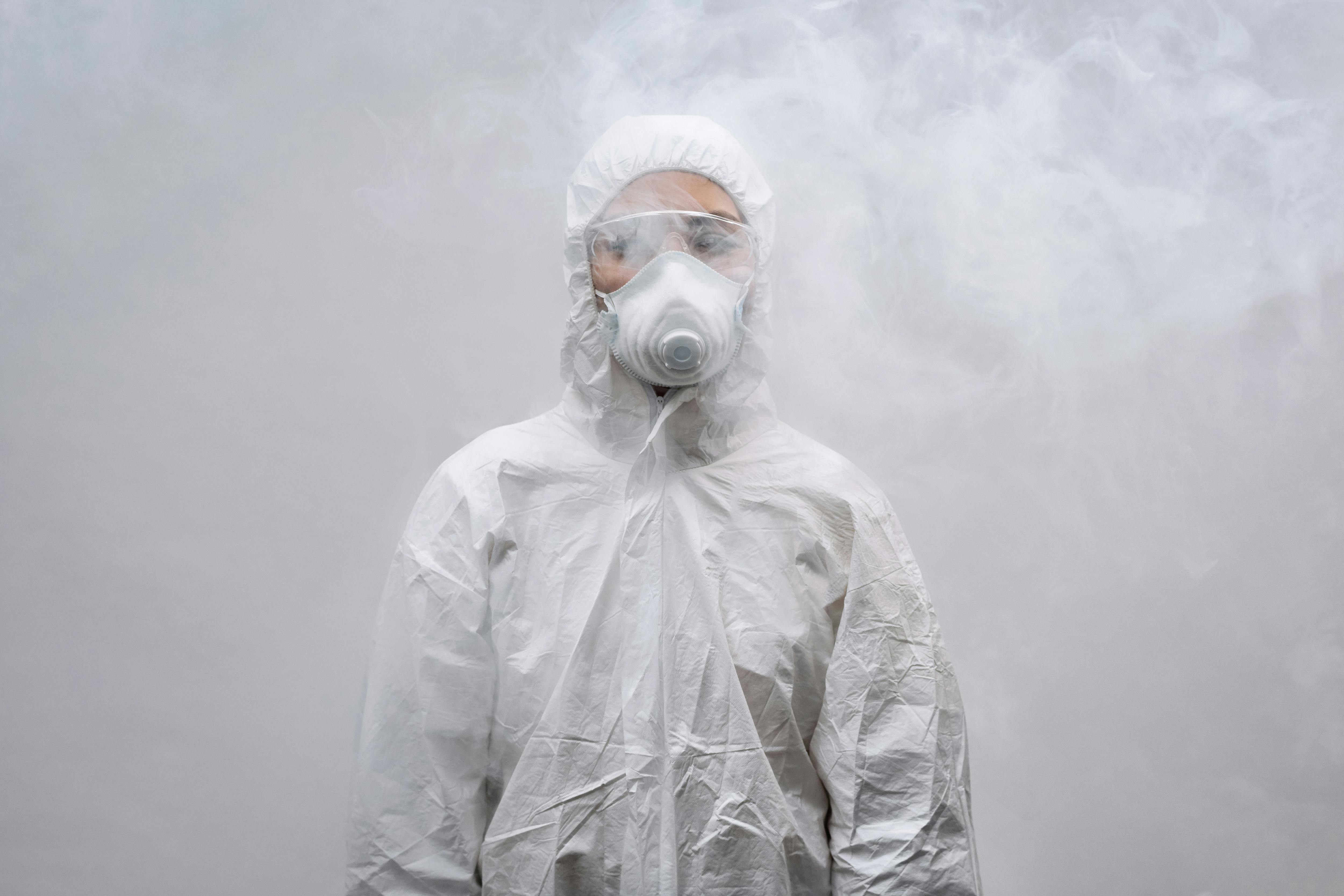 Man in protective suit and respirator looks at a white rat . vertical shot  Stock Video Footage by ©expsycholog.gmail.com #349075634