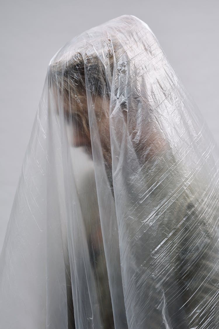 Clear Plastic Sheet Over A Person's Head