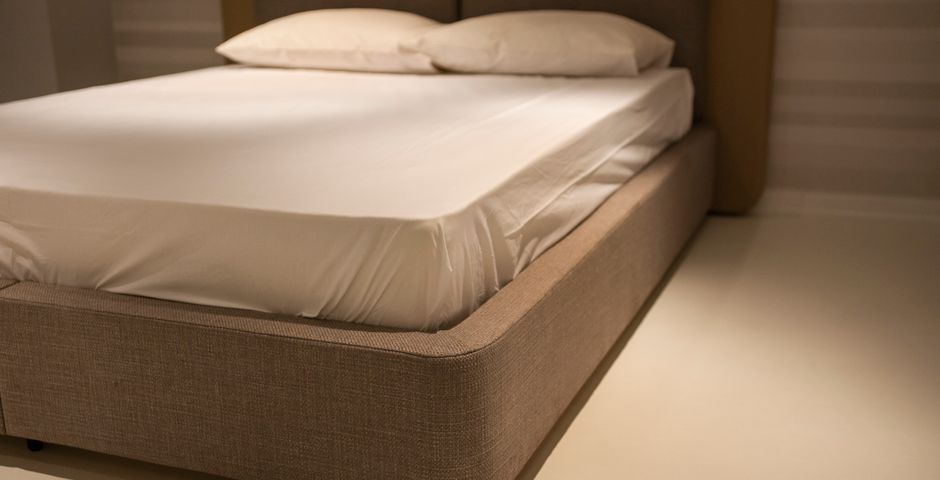 An unmade bed — bed bugs hide in mattress seams and headboards in Selangor rental units