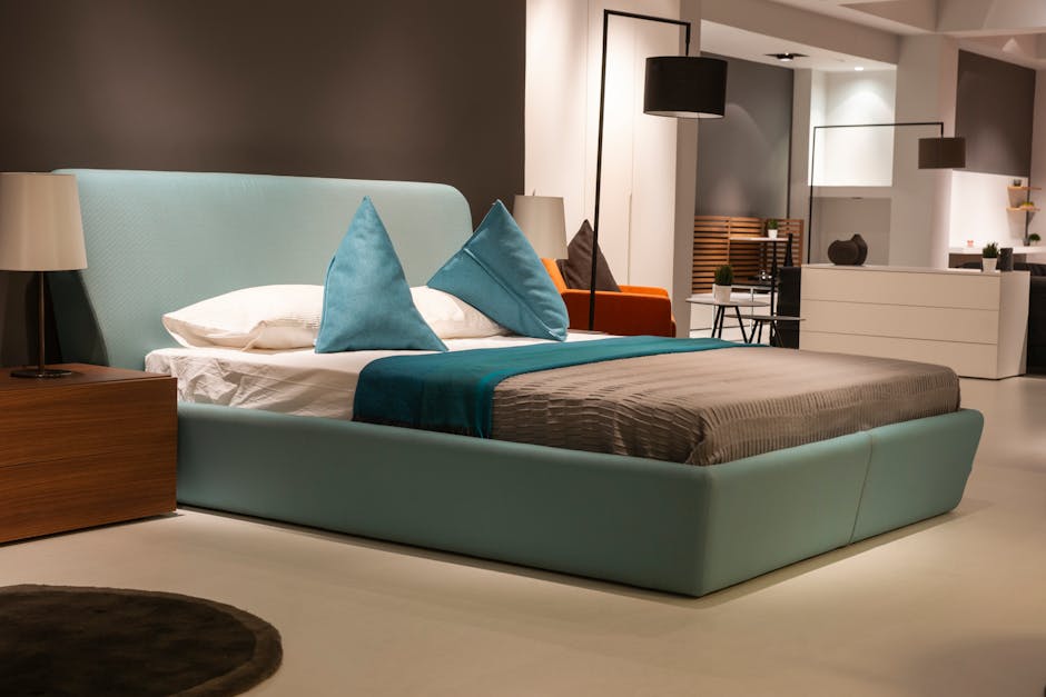 Stylish and modern bedroom interior design featuring a cozy bed with teal accents.
